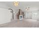 Bright living room featuring chandelier, ceiling fan, and access to dining and entry at 3643 Spring Willow Ct, Las Vegas, NV 89147