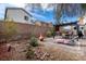 Relax in this backyard with a patio, lounge seating, and xeriscaping at 369 Monique Springs St, Henderson, NV 89014