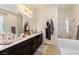 A bathroom featuring double sinks, shower, and separate toilet at 369 Monique Springs St, Henderson, NV 89014