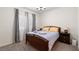 Cozy bedroom featuring neutral tones, carpet flooring, and natural light, perfect for relaxation at 369 Monique Springs St, Henderson, NV 89014