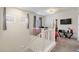Bright loft area features neutral paint, carpet, and a ceiling fan at 369 Monique Springs St, Henderson, NV 89014