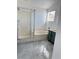 Bathroom with a soaking tub, a shower, and a single vanity at 3805 Carisbrook Dr, North Las Vegas, NV 89081