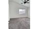 Bedroom with neutral carpet, a window, and a ceiling fan at 3805 Carisbrook Dr, North Las Vegas, NV 89081