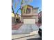 Two-story home boasts an attached garage and low-maintenance landscaping at 3805 Carisbrook Dr, North Las Vegas, NV 89081