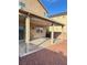Covered patio overlooking the backyard space with stone at 3805 Carisbrook Dr, North Las Vegas, NV 89081