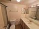Well-lit bathroom featuring a bathtub with shower, toilet, vanity with countertop and sink at 3967 Visby Ln, Las Vegas, NV 89119