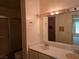 Bright bathroom with double sinks and vanity, well-lit by bulb lighting at 3967 Visby Ln, Las Vegas, NV 89119