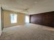 Large living room featuring plush carpeting and wood-paneled accent wall at 3967 Visby Ln, Las Vegas, NV 89119