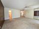 Expansive living room with carpet, a closet, and multiple entryways at 3967 Visby Ln, Las Vegas, NV 89119