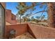 Balcony view from the residence showing trees and parking at 4050 Pacific Harbors Dr # 233, Las Vegas, NV 89121