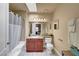 Bright bathroom showcasing a shower and tub, vanity, and tile floors at 4050 Pacific Harbors Dr # 233, Las Vegas, NV 89121