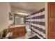 Bathroom featuring a full vanity, tile floors and a shower and tub combination at 4050 Pacific Harbors Dr # 233, Las Vegas, NV 89121