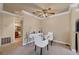 Dining area adjacent to the bathroom features a modern desk, round glass table, and comfortable seating at 4050 Pacific Harbors Dr # 233, Las Vegas, NV 89121
