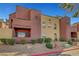 Condominium exterior showing well maintained landscaping and multiple units at 4050 Pacific Harbors Dr # 233, Las Vegas, NV 89121