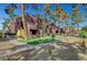 Multi-Gathering building featuring well-maintained landscaping, mature trees, and a walking path at 4050 Pacific Harbors Dr # 233, Las Vegas, NV 89121
