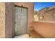 Front door of unit 233 featuring a small seating bench on the entry porch at 4050 Pacific Harbors Dr # 233, Las Vegas, NV 89121