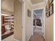 Hallway leading to bathroom with access to multiple rooms at 4050 Pacific Harbors Dr # 233, Las Vegas, NV 89121