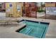 Close up view of a hot tub in a fenced in community area with pool rule signage at 4050 Pacific Harbors Dr # 233, Las Vegas, NV 89121