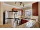 Kitchen featuring stainless steel appliances, granite counters and ample cabinet space at 4050 Pacific Harbors Dr # 233, Las Vegas, NV 89121