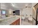 Bright living room features dining area, fireplace, and contemporary décor at 4050 Pacific Harbors Dr # 233, Las Vegas, NV 89121