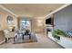 Bright living room featuring a fireplace, sliding glass doors, and contemporary decor at 4050 Pacific Harbors Dr # 233, Las Vegas, NV 89121