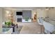 Wide angle of a spacious living room with breakfast bar, fireplace and modern decor at 4050 Pacific Harbors Dr # 233, Las Vegas, NV 89121