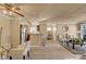 Spacious living room shows open layout, kitchen, and dining at 4050 Pacific Harbors Dr # 233, Las Vegas, NV 89121