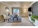 Bright living room featuring a fireplace, sliding glass doors, and contemporary decor at 4050 Pacific Harbors Dr # 233, Las Vegas, NV 89121