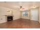 Light-filled living room featuring a fireplace, tile flooring, neutral walls, and a ceiling fan at 436 Concord Way, Henderson, NV 89015