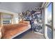 Bright bedroom featuring wallpaper, a modern bed, city views, and natural light at 4471 Dean Martin Dr # 2101, Las Vegas, NV 89103