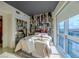 Comfortable bedroom features modern decor, unique wallpaper, and expansive city views at 4471 Dean Martin Dr # 2101, Las Vegas, NV 89103