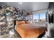 Bedroom featuring decorative wallpaper, a modern bed, and city views through bright windows at 4471 Dean Martin Dr # 2101, Las Vegas, NV 89103