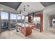 Modern kitchen with granite countertops, stainless steel appliances, bar seating, and amazing city views at 4471 Dean Martin Dr # 2101, Las Vegas, NV 89103
