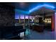 Modern living room with cityscape view, chalkboard accent wall and island kitchen with stainless steel appliances at 4471 Dean Martin Dr # 2101, Las Vegas, NV 89103