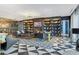 Elegant lounge with dark wood bookshelves, a cozy fireplace, and stylish black and white geometric tile at 4471 Dean Martin Dr # 2101, Las Vegas, NV 89103