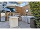 Gourmet outdoor kitchen featuring a built-in grill, marble counter, and sink at 4471 Dean Martin Dr # 2101, Las Vegas, NV 89103