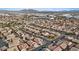Community aerial view showcasing desert landscaping, tile roofs, and solar panels in suburban neighborhood near mountains at 4632 Cantina Rey St, North Las Vegas, NV 89081