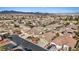Expansive aerial view of a well-planned community showcasing similar single-Gathering homes and mountain views at 4632 Cantina Rey St, North Las Vegas, NV 89081