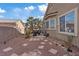 Backyard with palm tree and sitting area at 4632 Cantina Rey St, North Las Vegas, NV 89081