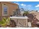 Backyard with hot tub, covered seating area, and desert landscaping at 4632 Cantina Rey St, North Las Vegas, NV 89081
