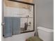 Shower tub combo with detachable seat and wand showerhead; grab bar present for additional safety at 4632 Cantina Rey St, North Las Vegas, NV 89081