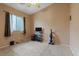 Bedroom with carpet, and a window and a shelf unit with television at 4632 Cantina Rey St, North Las Vegas, NV 89081