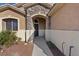 Charming entrance with stone archway and black front door at 4632 Cantina Rey St, North Las Vegas, NV 89081