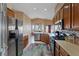 Modern kitchen featuring granite countertops, stainless steel appliances, and ample cabinet space at 4632 Cantina Rey St, North Las Vegas, NV 89081