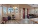 Bright and airy living room with hard surface floors, neutral walls, recessed lighting, and a sliding glass door at 4632 Cantina Rey St, North Las Vegas, NV 89081