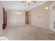 Spacious living room featuring carpet, neutral walls, a ceiling fan, and decorative lighting at 4632 Cantina Rey St, North Las Vegas, NV 89081
