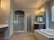 Serene bathroom featuring a soaking tub, walk-in shower, and dual vanities at 4912 Capo Gallo St, Las Vegas, NV 89130