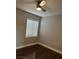 Cozy bedroom with a single window and sleek hardwood floors at 4912 Capo Gallo St, Las Vegas, NV 89130