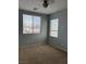 Bedroom with neutral carpet and walls with two windows for natural light at 4912 Capo Gallo St, Las Vegas, NV 89130