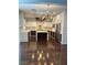 Gourmet kitchen featuring stainless steel appliances, white cabinetry, and hardwood flooring at 4912 Capo Gallo St, Las Vegas, NV 89130